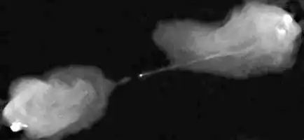 Description de l'image par IA : Deux grandes régions lumineuses avec un fin faisceau les reliant, sur fond sombre.