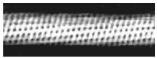 Description de l'image par IA : Motifs répétitifs en forme de losange sur fond clair, bordé de noir.